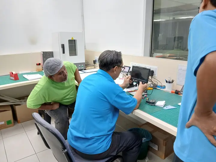 QA staff inspecting a sample